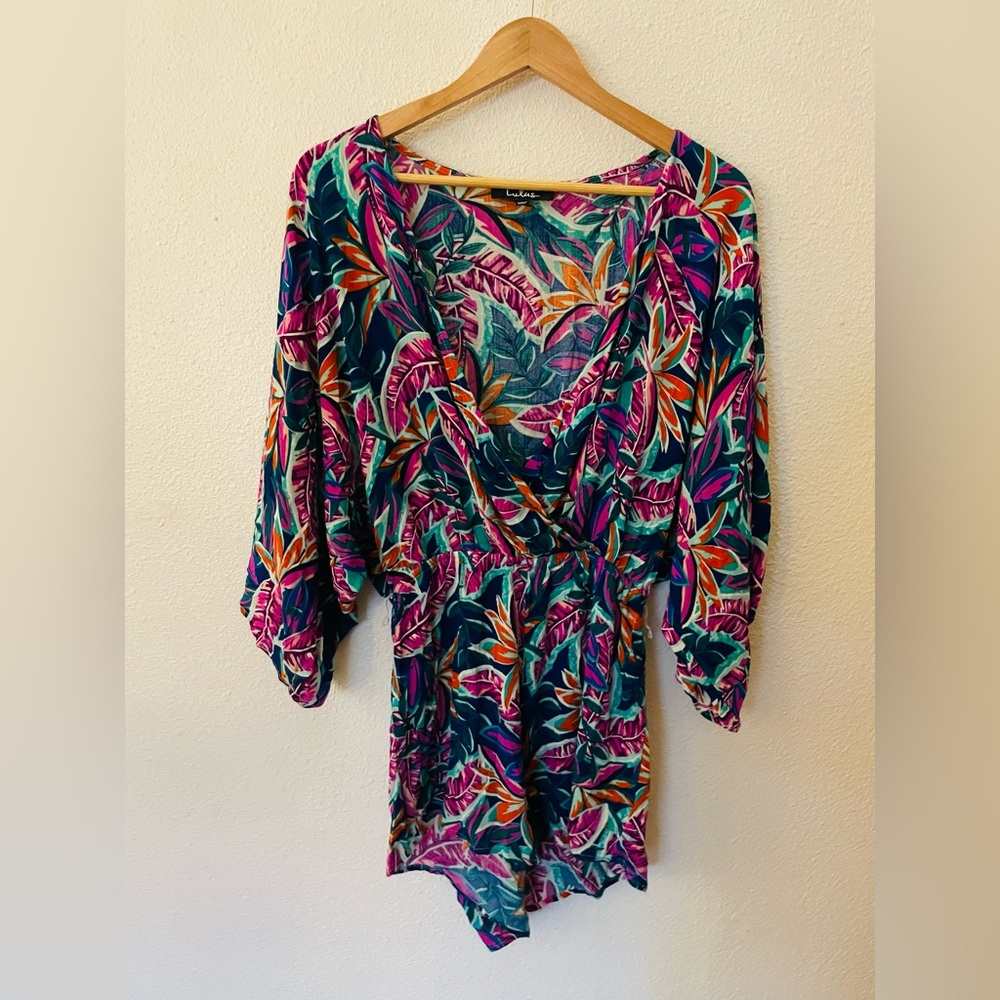 Lulus Hypnotized Purple Print Romper, featuring a vibrant leaf print Size Medium